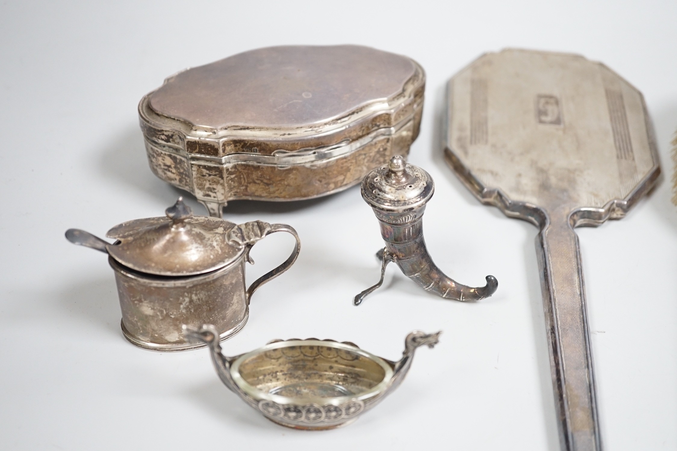 A George V silver mounted trinket box, Elkington & Co, Birmingham, 1918, 13.1cm, a silver mustard pot, two Scandinavian 925 condiments, two silver mounted scent bottles, hatpins and hatpin stand and a silver mounted thre